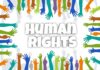 Graphic image showing coloured hands outstretched towards the words Human Rights in the middle