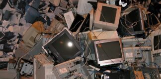 Photo, colours, a pile of old computers, monitors and e-waste