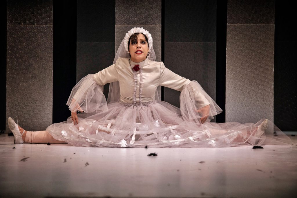 Photo, colours, actress performing on stage, drama: "I am a woman. Do you hear me?" by Iranian Camelia Ghazali
