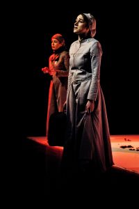 Photo, colours, 2 women performing on stage, drama: "I am a woman. Do you hear me?" by Iranian Camelia Ghazali