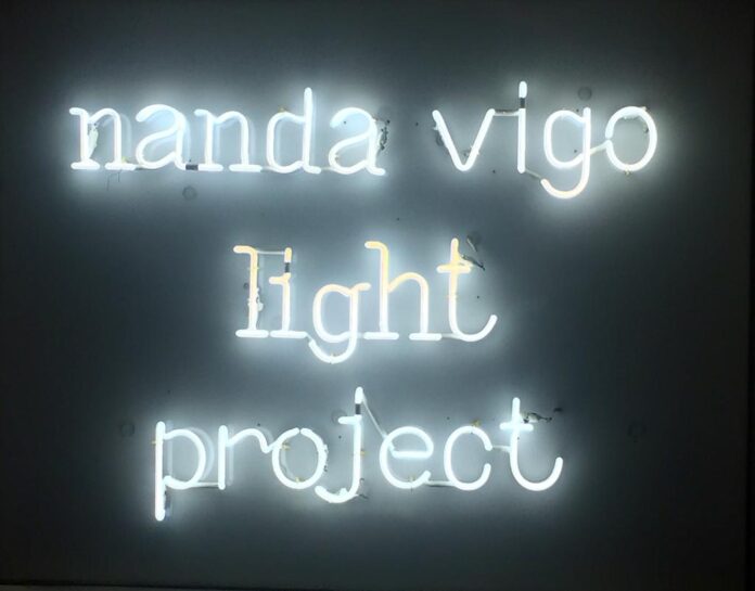 Text with illuminated letters bearing the words Nanda Vigo Light Project, title of the exhibition by Nanda Vigo held in 2019 in Milan, Palazzo Reale