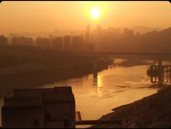 Chongqing China, a view of the industrial district of the chinese city, sunset
