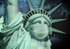 The virus of the pandemia that comes from China is on the background of the Statue of Liberty wearing a protective mask.