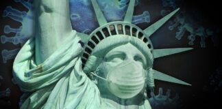 Il virus della pandemia, che viene dalla Cina, fa da sfondo alla Statua della libertà che indossa una mascherina protettiva.