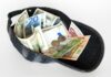 A common debt in Europe? picture of a baseball cap full of banknotes