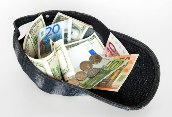 A common debt in Europe? picture of a baseball cap full of banknotes
