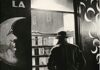 Paris literature, vintage picture, black and white, man from behind in front of a shop window