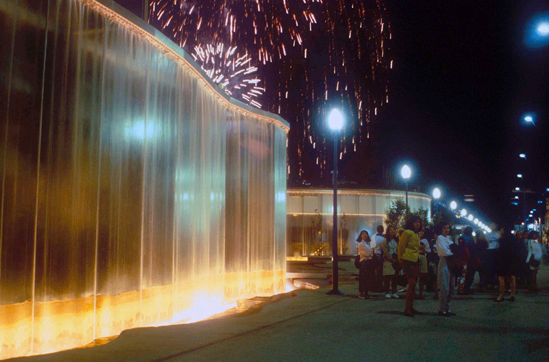 in the color photo you can see a cascade of illuminated light created by James Wines on the occasion of the Seville Expo in 1992