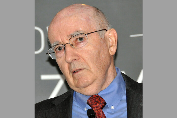 you can see Philip Kotler, a famous university teacher of marketing. He wears a red tie and a blu shirt.