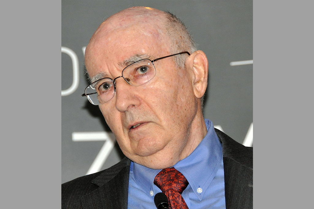 Philip Kotler you can see Philip Kotler, a famous university teacher of marketing. He wears a red tie and a blu shirt.