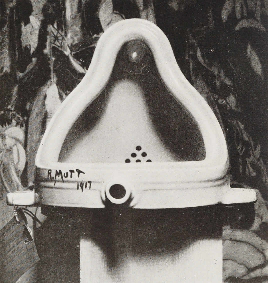 The picture is a black and white photography of Marcel Duchamp's famous artwork "Fontaine" that consist in a stolen and reversed urinal with a black signature on the lower part "R.MUTT 1917"