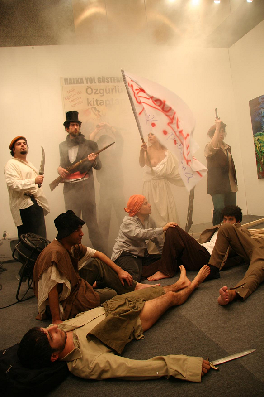 The picture shows a work by Bedri Baykam, Liberty leading people, Delacroix Happening 2006.