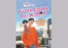 The picture (on a grey background) shows the cover of the book "Tutta colpa del K-pop. Diario pannocchioso di un italiano in Corea" by Seoul Mafia. The autor is in the center of the picture, wearing an orange shirt. The South Korean capital, Seoul is on the background while the title and a manga-version of the author are over the picture