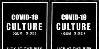 Foto dell'opera mail art, autore Chuck Welch, che rappresenta due francobolli, su sfondo nero le scritte covid-19 culture (gum side) lick at own risk (lecca a tuo rischio)
