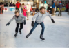 in the color photo you can see two boys ice skating