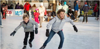in the color photo you can see two boys ice skating