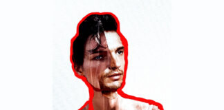 nella foto si vede un'opera che ritrae la sorella dell'artista Marilena Vita con la barba, circondata da un bordo rosso. Questa persona indossa una canottiera bianca.