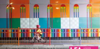 London Festival of Architecture, the poster: a colorful wall, a boardwalk with a baby boy on a bicycle, a colorful protective railing