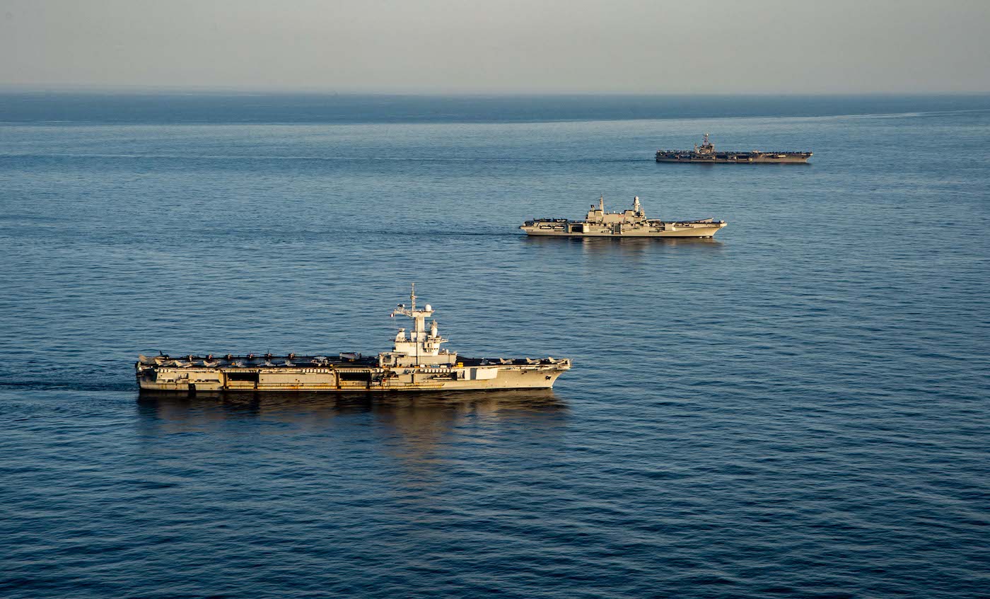 USS Harry S. Truman (CVN 75) transits the Atlantic Ocean. The U.S. Navy aircraft carrier USS Harry S. Truman (CVN-75), top, the Italian aircraft carrier Cavour (550) and the French aircraft carrier Charles de Gaulle (R 91) underway in the Mediterranean Sea in formation on 6 February 2022.